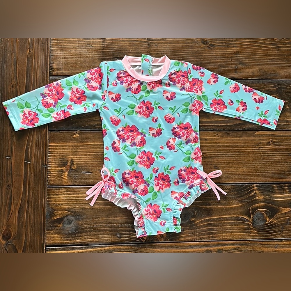 RUFFLE BUTTS one piece floral long sleeve swimsuit